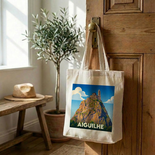 Tote bag souvenir de la ville d'Aiguilhe orné d'une illustration stylisée du rocher et de sa chapelle.