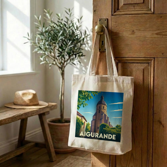 Tote bag souvenir de la ville d'Aigurande avec une illustration stylisée de son église.