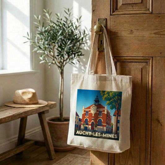 Tote bag souvenir de la ville de Auchy-les-Mines avec une illustration stylisée d'un bâtiment historique.
