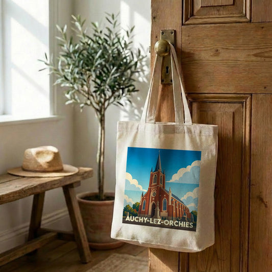 Tote bag souvenir de la ville de Auchy-lez-Orchies avec une illustration stylisée de son église.