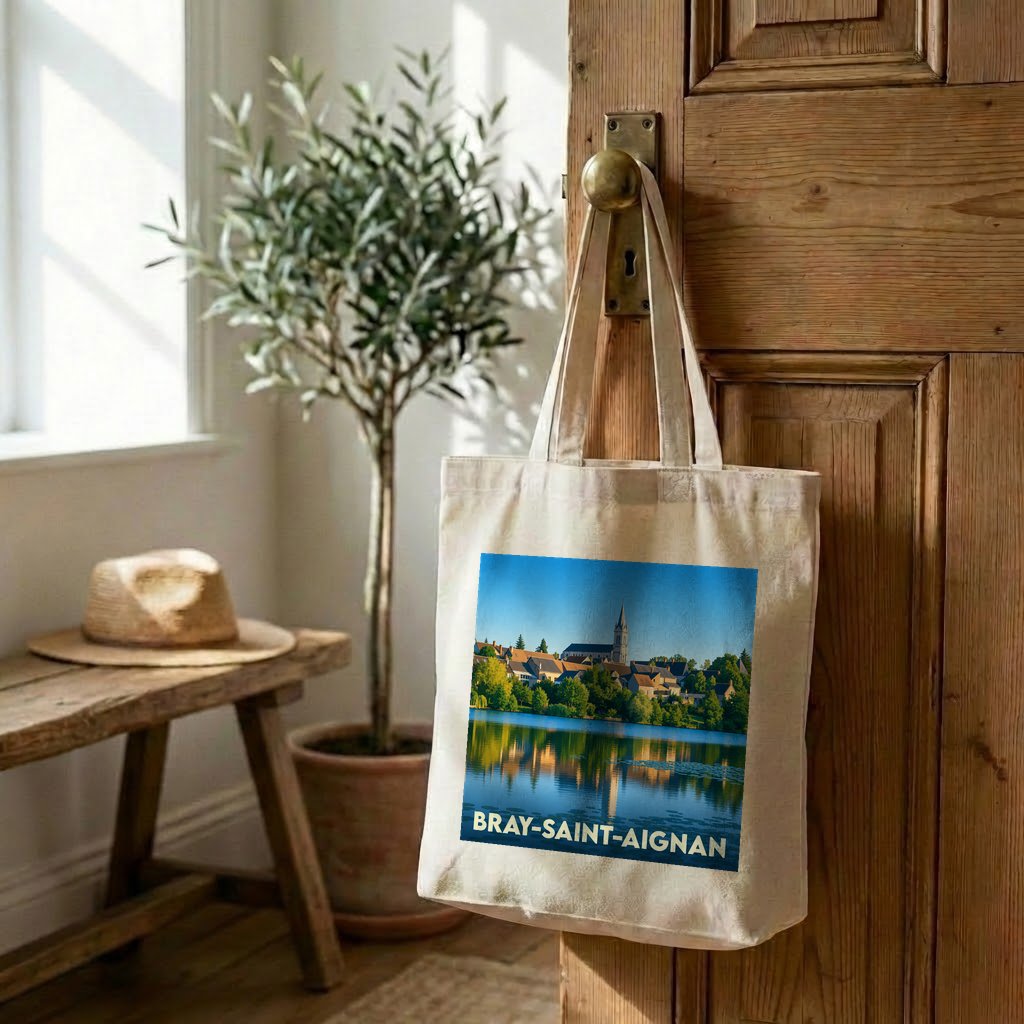 Tote bag souvenir de la ville de Bray-Saint-Aignan avec une illustration d'un paysage au bord de l'eau.