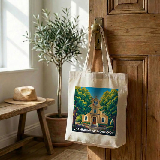 Tote bag souvenir de la ville de Champagne-au-Mont-d'Or avec une illustration stylisée.