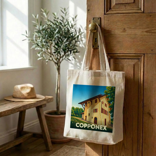 Tote bag souvenir de la ville de Copponex avec une illustration stylisée d'une maison traditionnelle.