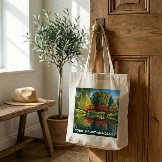 Tote bag souvenir de la ville de Couilly-Pont-aux-Dames avec une illustration stylisée d'un pont rouge.
