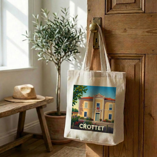 Tote bag souvenir de la ville de Crottet avec une illustration stylisée de sa mairie.