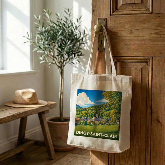 Tote bag souvenir de la ville de Dingy-Saint-Clair avec une illustration stylisée de paysage montagneux.