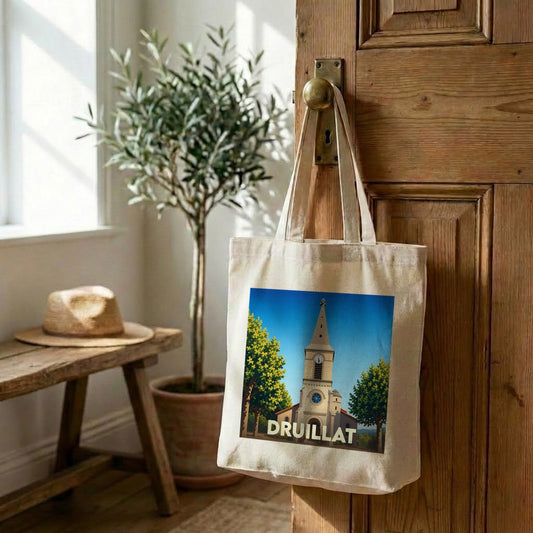 Tote bag souvenir de la ville de Druillat avec une illustration stylisée de son église.
