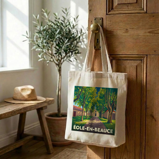 Tote bag souvenir de la ville d'Éole-en-Beauce avec une illustration stylisée d'une allée arborée.
