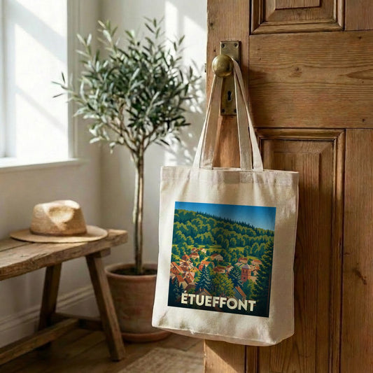 Tote bag souvenir de la ville d'Étueffont avec une illustration stylisée d'un paysage de montagne.