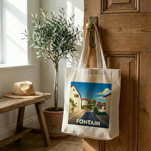Tote bag souvenir de la ville de Fontain avec une illustration stylisée d'un paysage urbain.