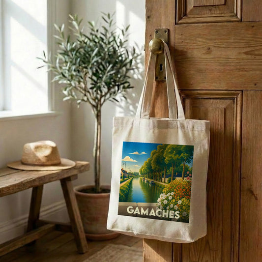 Tote bag souvenir de la ville de Gamaches avec une illustration stylisée d'un canal arboré.