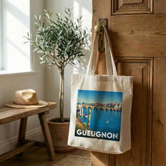 Tote bag souvenir de la ville de Gueugnon avec une illustration stylisée d'un pont sur une rivière.