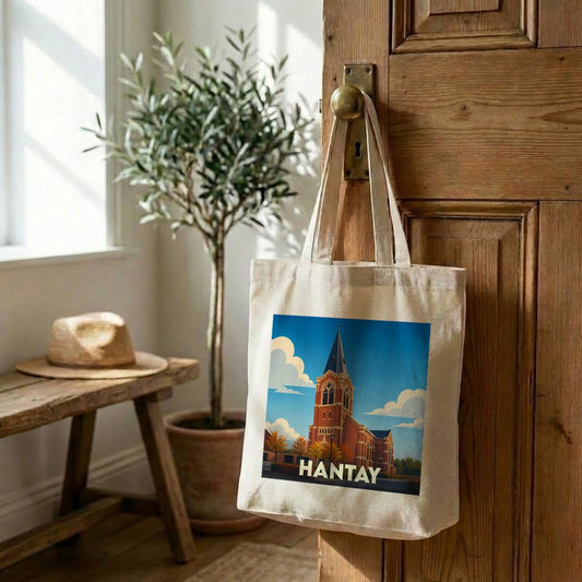 Tote bag souvenir de la ville de Hantay avec une illustration stylisée de son église.