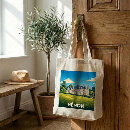Tote bag souvenir de la ville de Hénon avec une illustration stylisée.