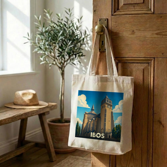 Tote bag souvenir de la ville d'Ibos avec une illustration stylisée de son église collégiale.