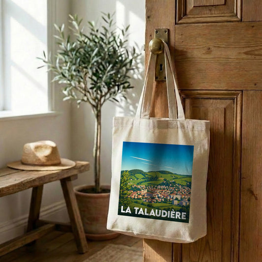 Tote bag souvenir de la ville de La Talaudière avec une illustration paysagère stylisée.