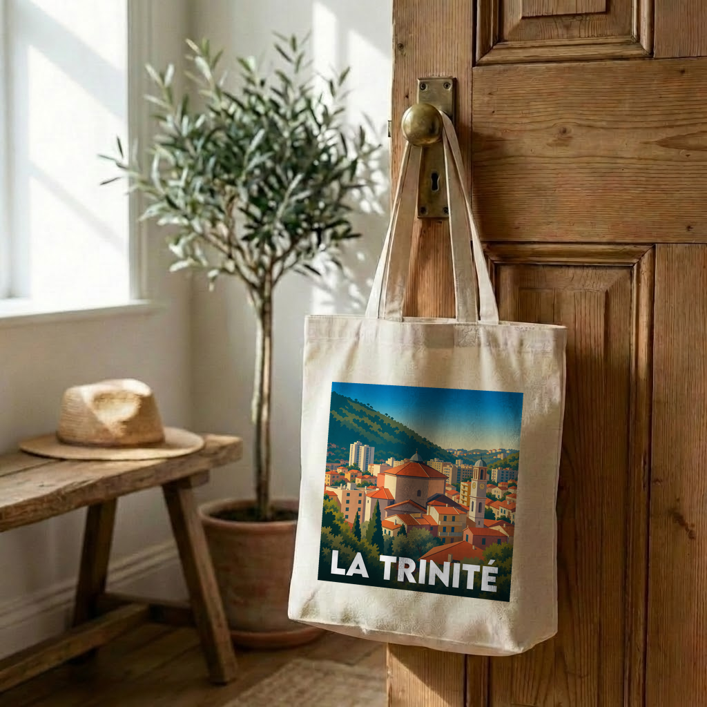 Tote bag souvenir de la ville de La Trinité avec une illustration stylisée.