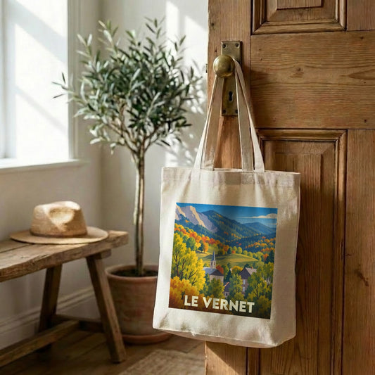 Tote bag souvenir de la ville de Le Vernet avec une illustration automnale stylisée.