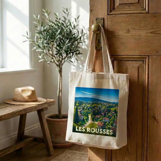 Tote bag souvenir de la ville de Les Rousses avec une illustration de paysage de montagne.