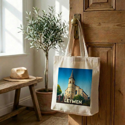 Tote bag souvenir de la ville de Leymen avec une illustration stylisée de son église.