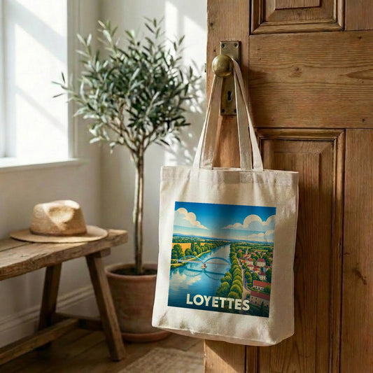 Tote bag souvenir de la ville de Loyettes avec une illustration stylisée d'un paysage fluvial.