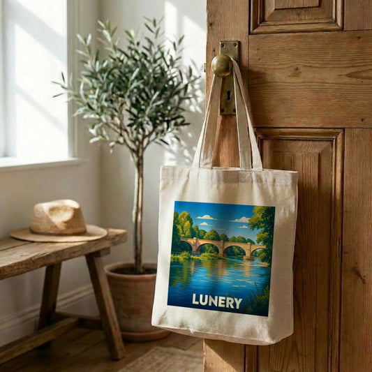Tote bag souvenir de la ville de Lunery avec une illustration stylisée d'un pont sur une rivière.