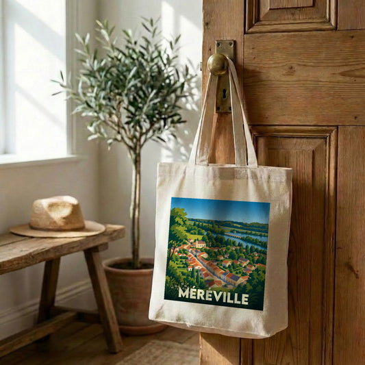 Tote bag souvenir de la ville de Méréville avec une illustration stylisée de son paysage urbain.