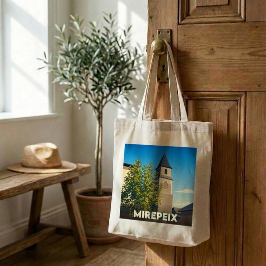Tote bag souvenir de la ville de Mirepeix avec une illustration stylisée d'un clocher.