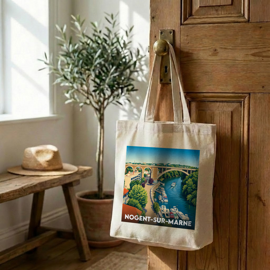 Tote bag souvenir de la ville de Nogent-sur-Marne avec une illustration stylisée d'un pont surplombant la rivière.