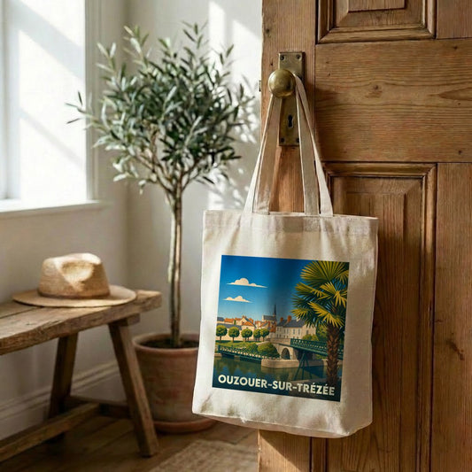 Tote bag souvenir de la ville d'Ouzouer-sur-Trézée avec une illustration stylisée.