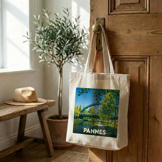 Tote bag souvenir de la ville de Pannes avec une illustration stylisée d'un pont au-dessus de l'eau.