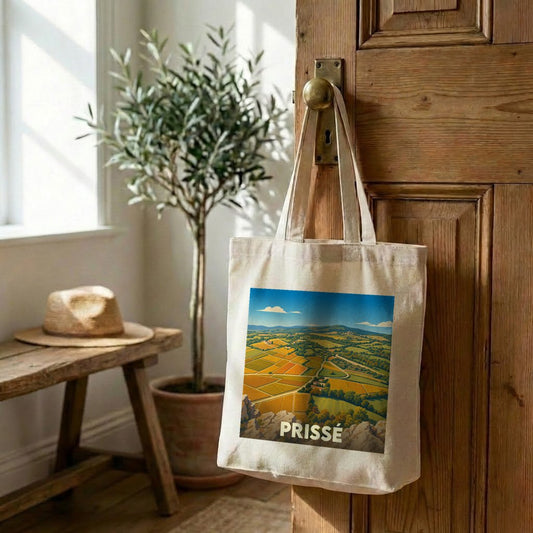 Tote bag souvenir de la ville de Prissé illustré d'un paysage de vignobles stylisé.