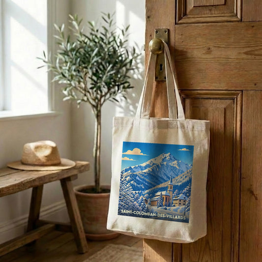 Tote bag souvenir de la ville de Saint-Colomban-des-Villards avec une illustration de paysage enneigé.