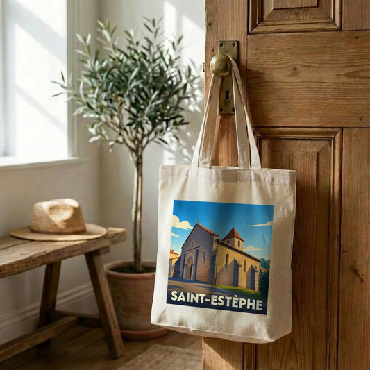 Tote bag souvenir de la ville de Saint-Estèphe avec une illustration stylisée de son église.
