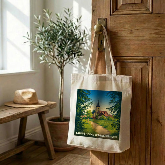 Tote bag souvenir de Saint-Étienne-lès-Remiremont illustré d'un paysage de village pittoresque.