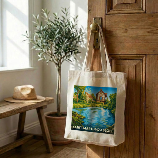 Tote bag souvenir de la ville de Saint-Martin-d'Ablois avec une illustration stylisée d'un paysage au bord de l'eau.