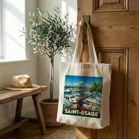 Tote bag souvenir de la ville de Saint-Usage avec une illustration stylisée d'un port de plaisance.