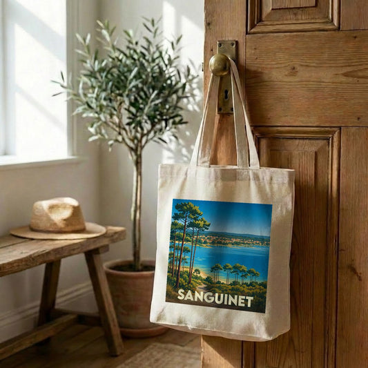 Tote bag souvenir de la ville de Sanguinet avec une illustration stylisée de son lac et de ses pins.
