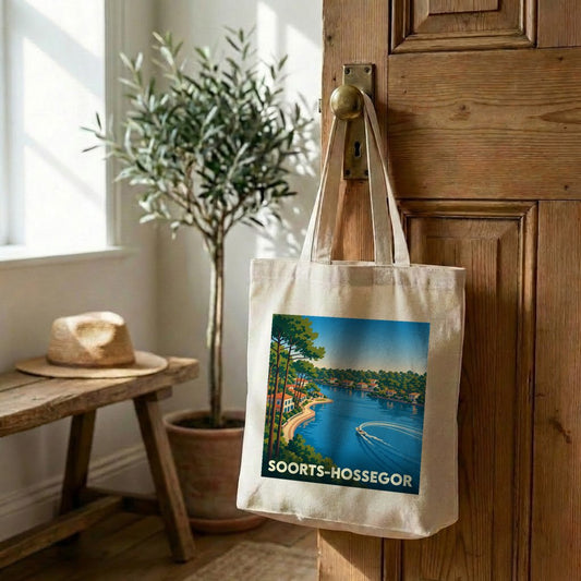 Sac cabas souvenir de la ville de Soorts-Hossegor avec une illustration de paysage lacustre.