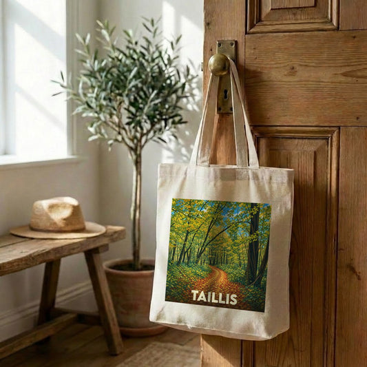 Tote bag souvenir de la ville de Taillis avec une illustration de forêt automnale.