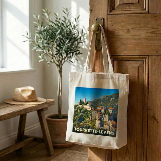 Sac cabas souvenir de Tourrette-Levens avec une illustration stylisée du village perché.