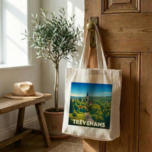 Tote bag souvenir de la ville de Trévenans avec une illustration paysagère stylisée.