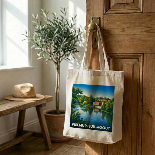 Tote bag souvenir de la ville de Vielmur-sur-Agout avec une illustration stylisée d'un paysage fluvial.